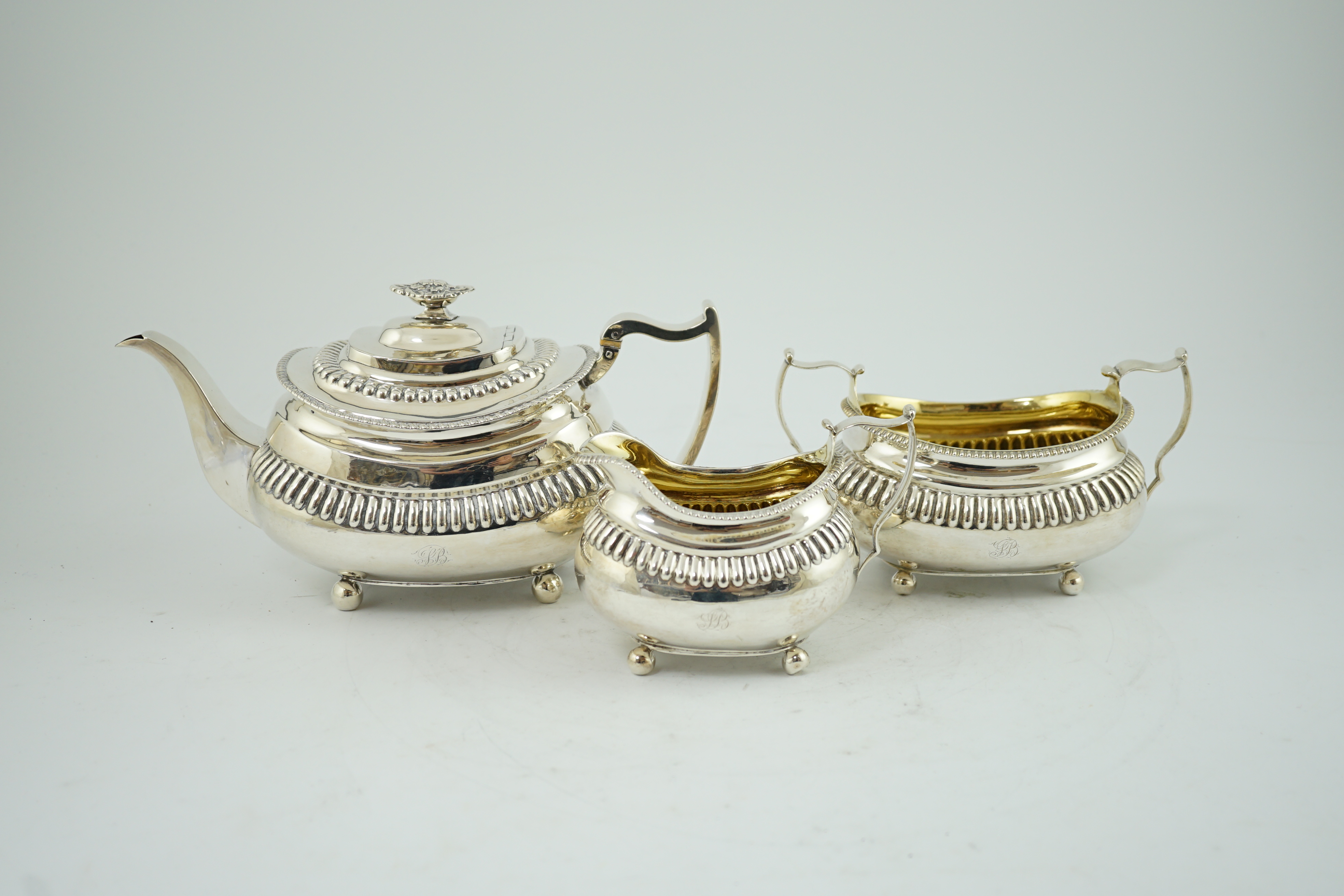 A George III silver three piece tea set, by Soloman Hougham